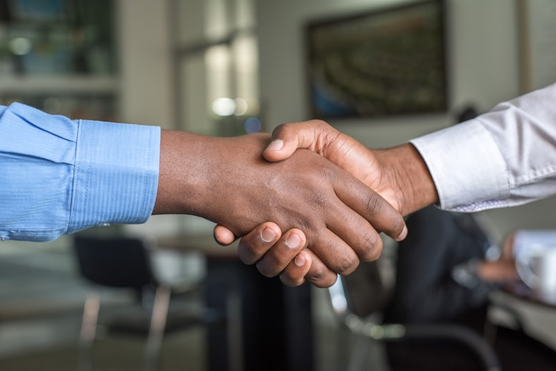 Recruiter shaking hands with an international candidate in Japan
